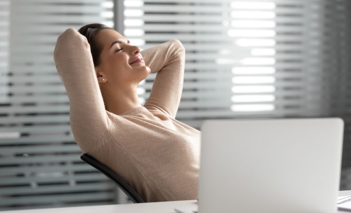 Office worker enjoying her safe and comfortable office space