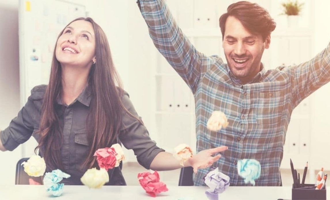 Employee playing with crumpled paper