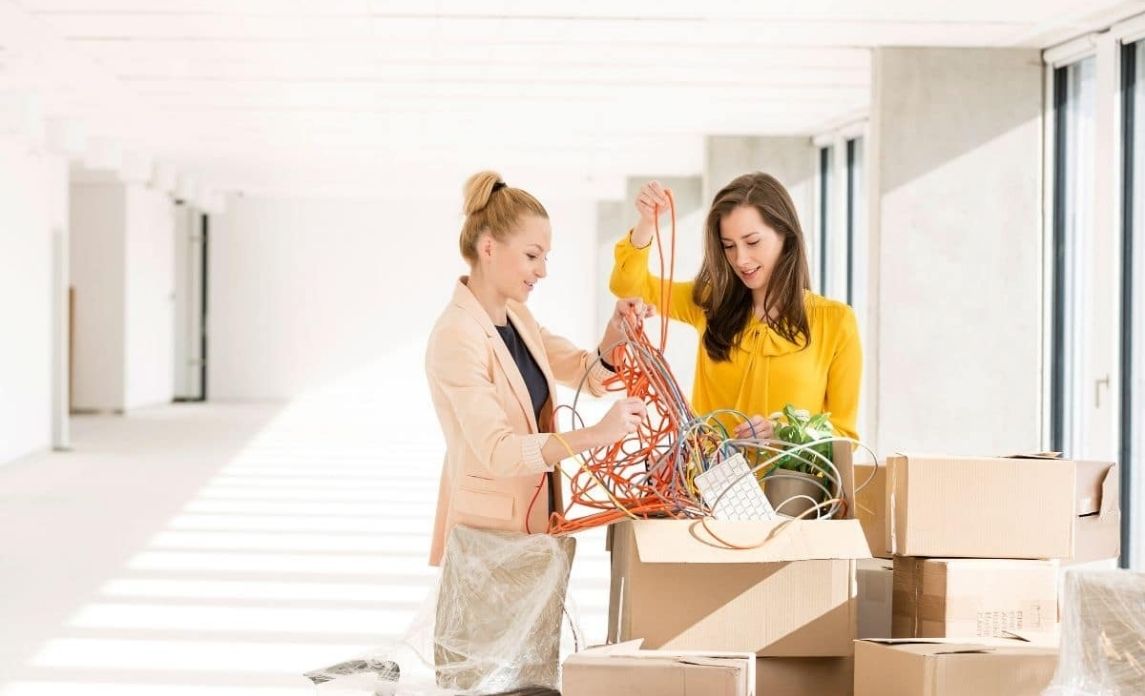Office girls unpacking new office