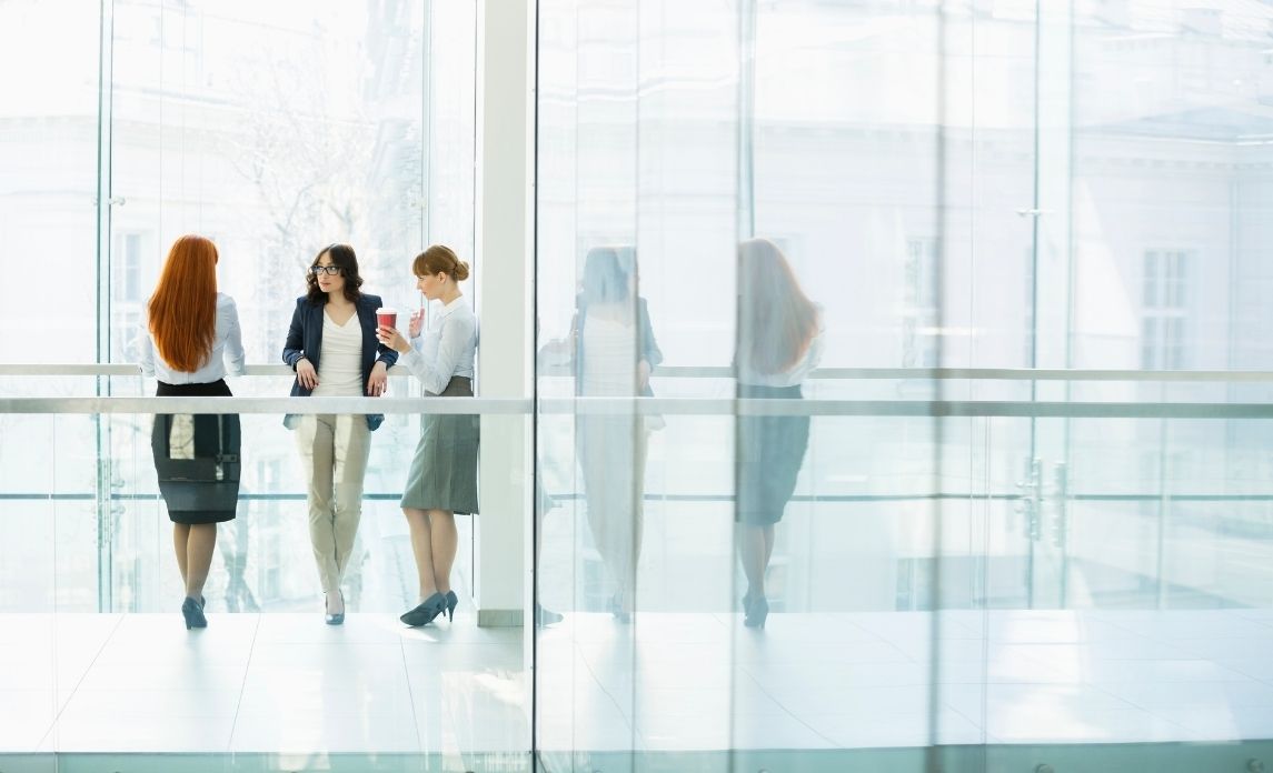 Employees having a conversation in a clean office