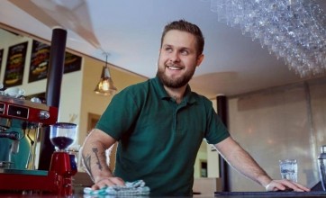 Bartender wiping and cleaning the bar