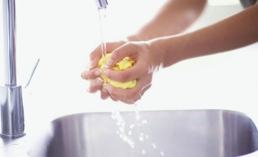 Wringing yellow washcloth